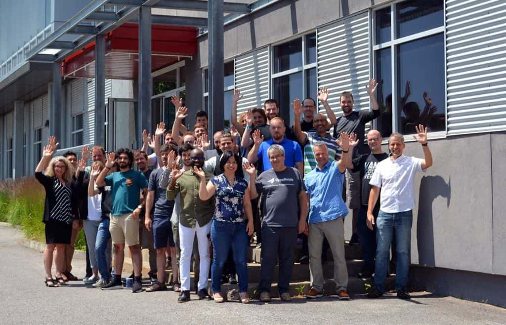 Group photo standing outside of front entrance from Quebec Bentley office